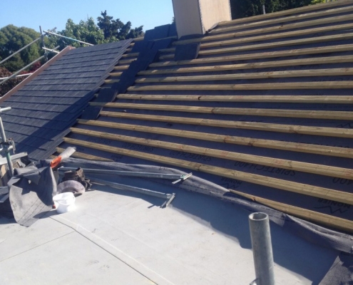 Image of Spanish Slate roofing being installed